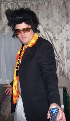 Elvis striking a pose with a can of Coors Light - the King liked his brew